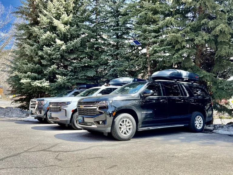 Three airport shuttle vehicles ready for passenger transportation