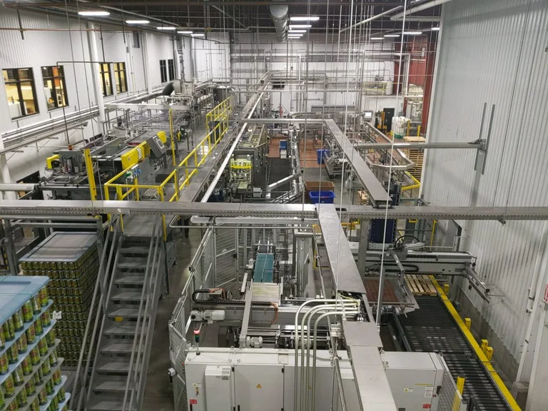 Modern industrial production facility with machinery and supply lines